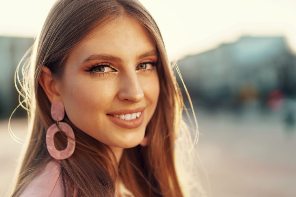 Close up portrait of a woman walking in the street